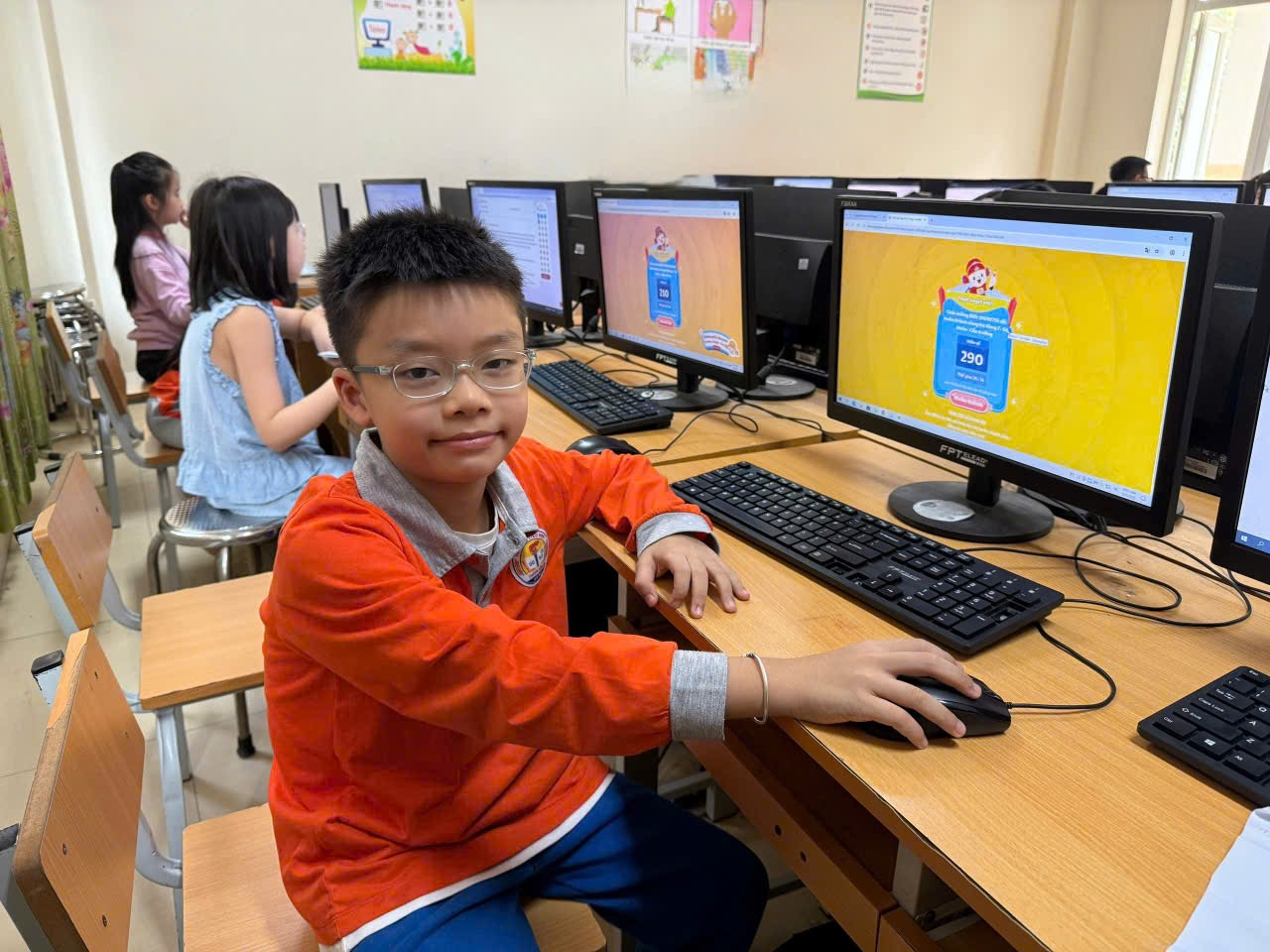 A child sitting at a desk with a computer
AI-generated content may be incorrect.