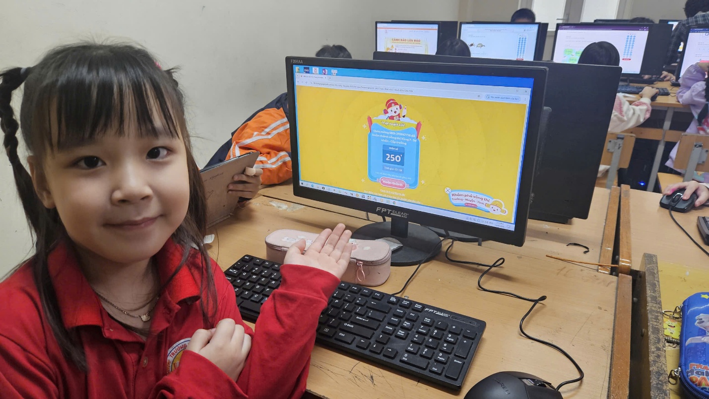 A child sitting at a desk with a computer
AI-generated content may be incorrect.
