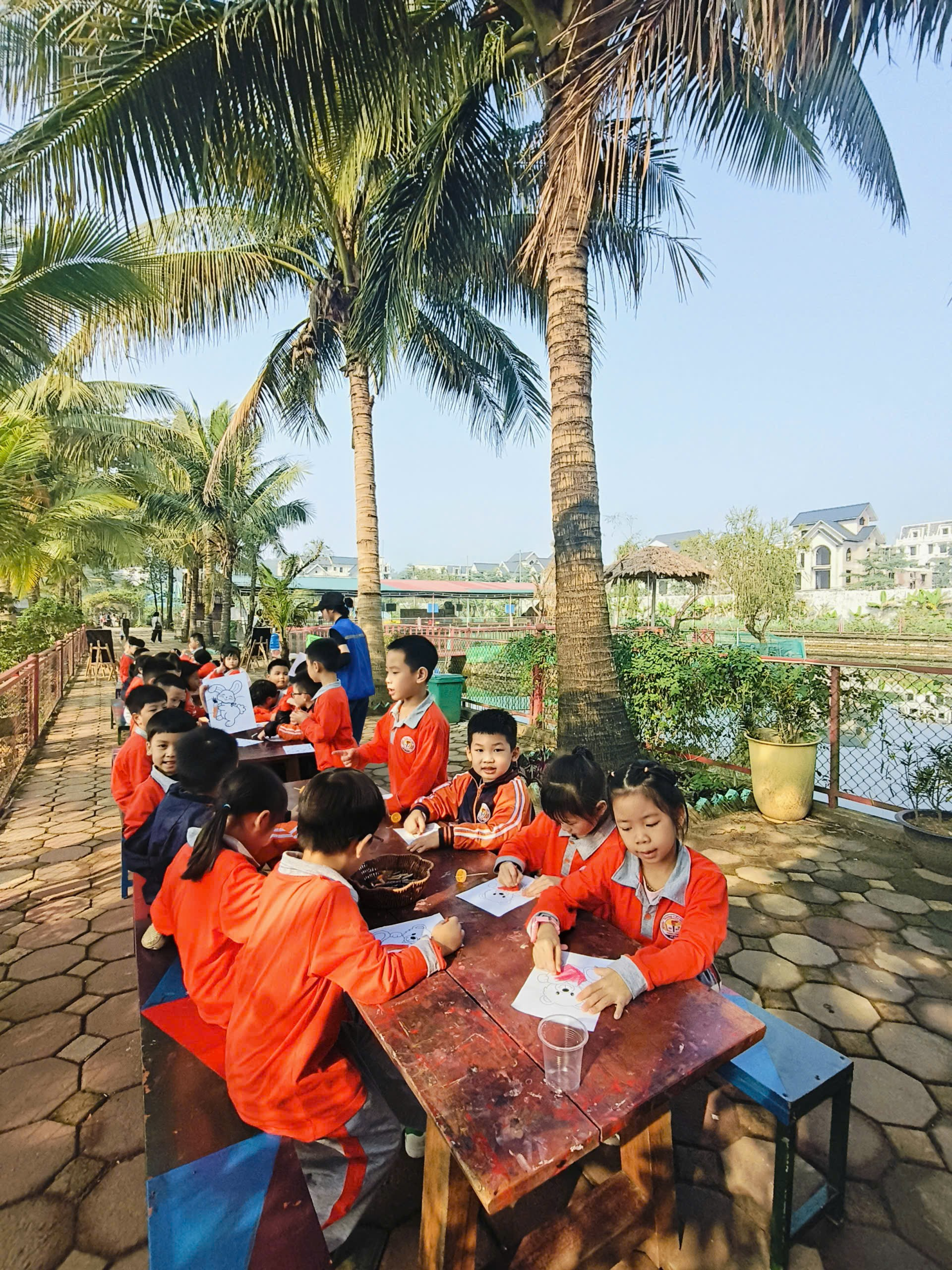 A group of children sitting at a table
AI-generated content may be incorrect.