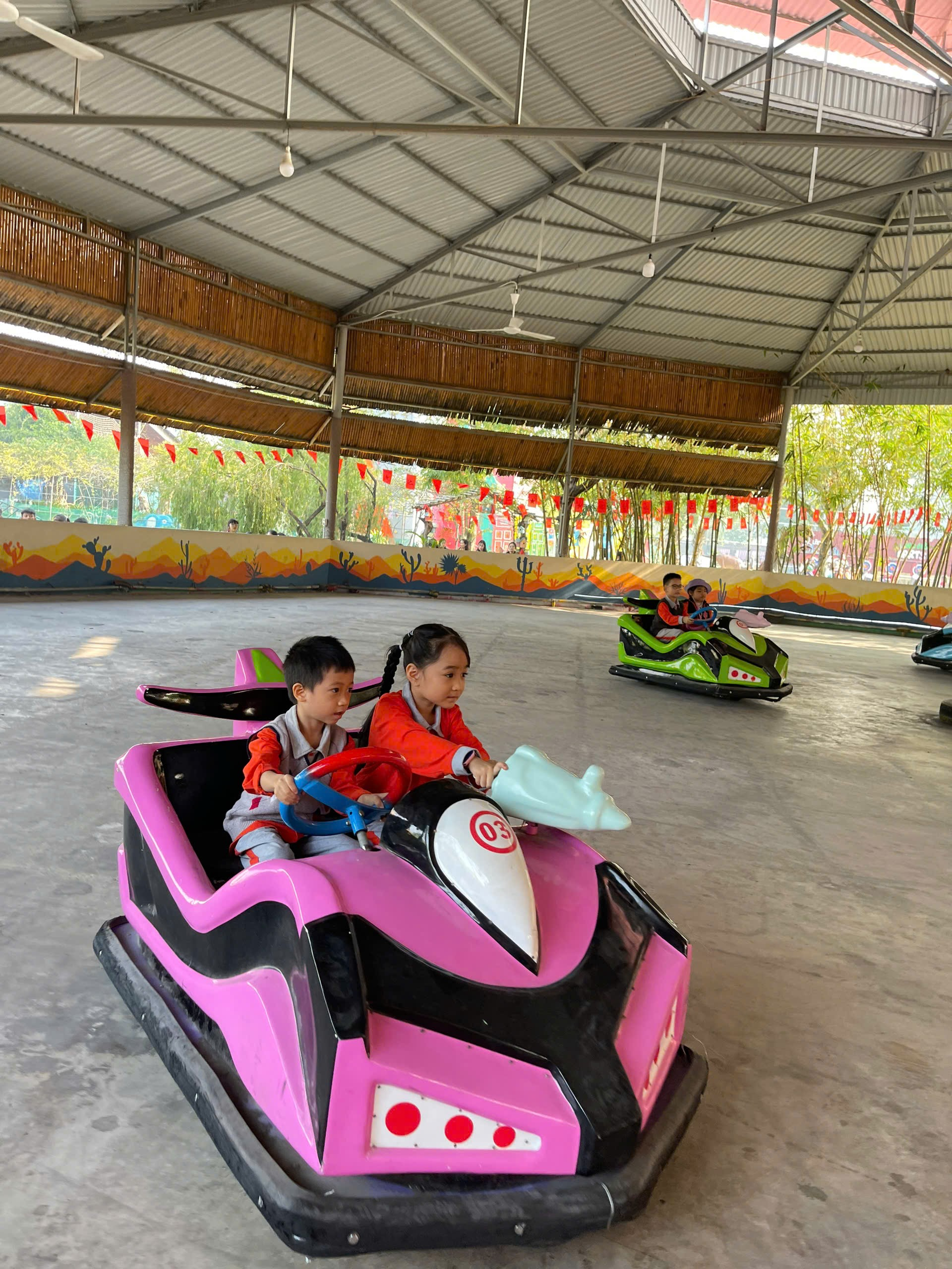 A group of kids riding in bumper cars
AI-generated content may be incorrect.