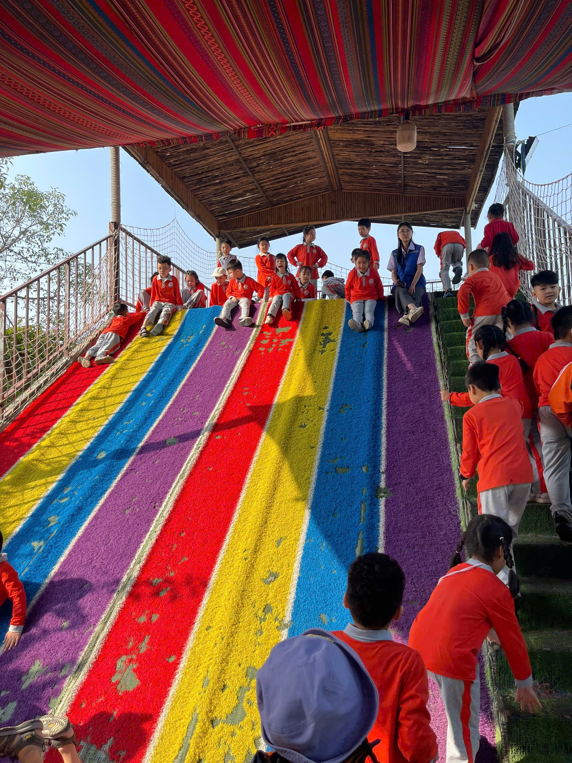 A group of people on a colorful staircase
AI-generated content may be incorrect.