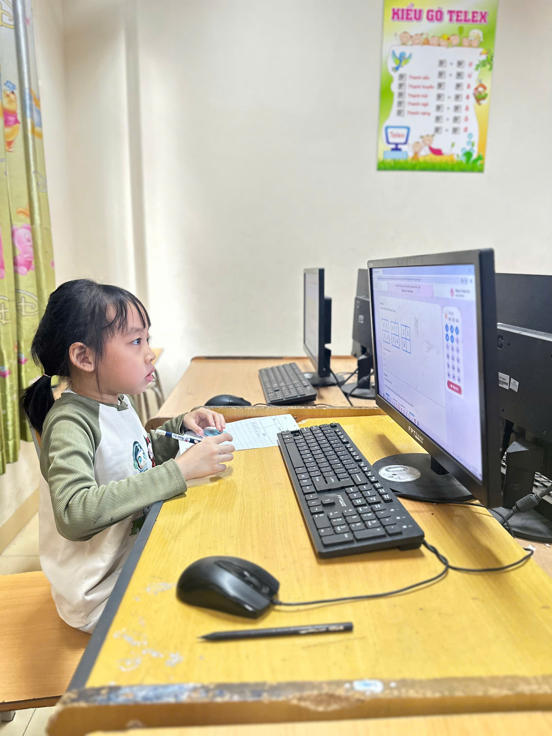 A child sitting at a desk with a computer

AI-generated content may be incorrect.