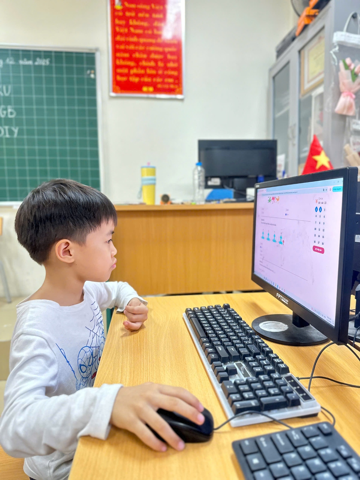 A child sitting at a desk with a computer

AI-generated content may be incorrect.