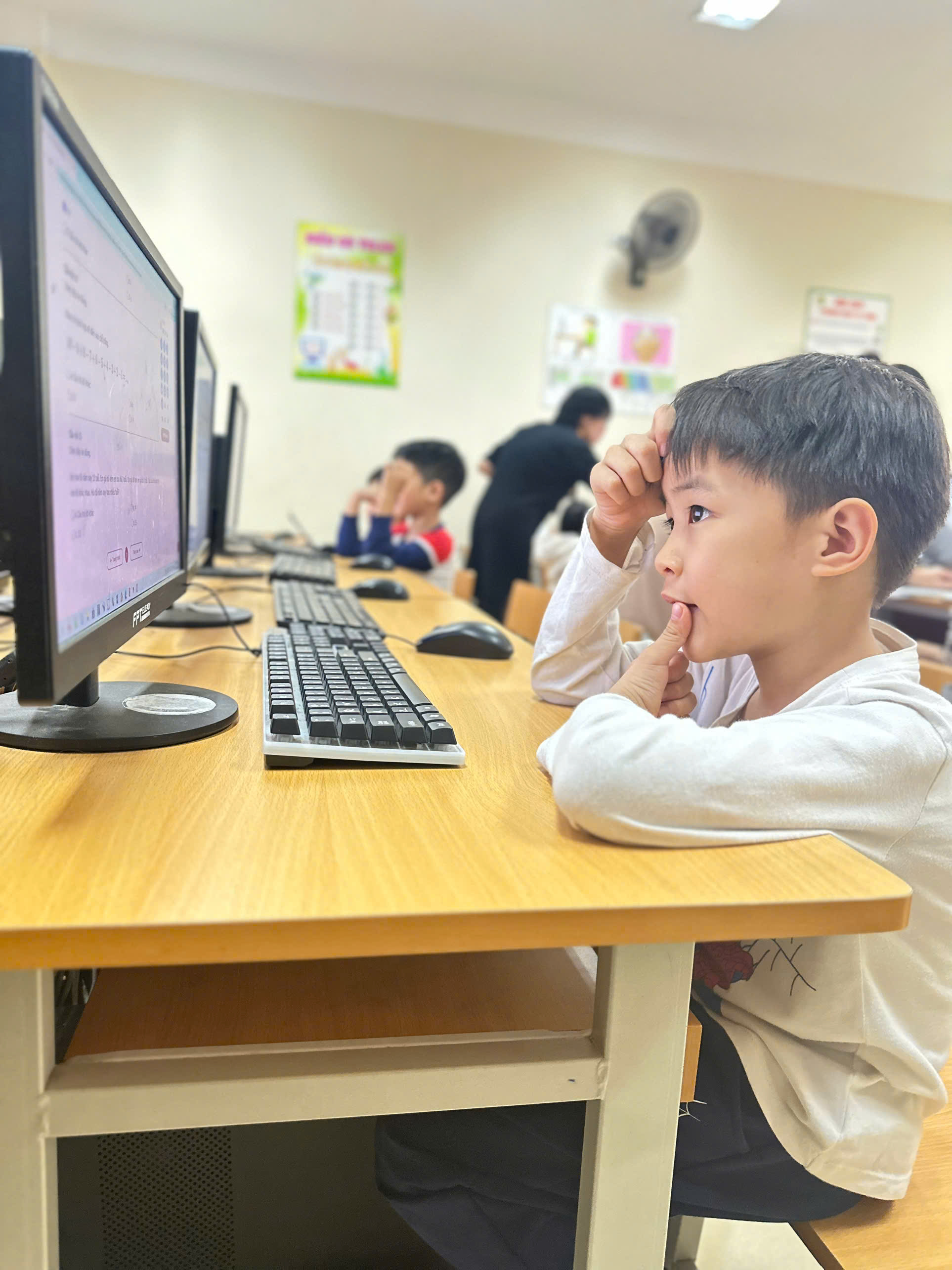 A child sitting at a desk with his hand on his head

AI-generated content may be incorrect.