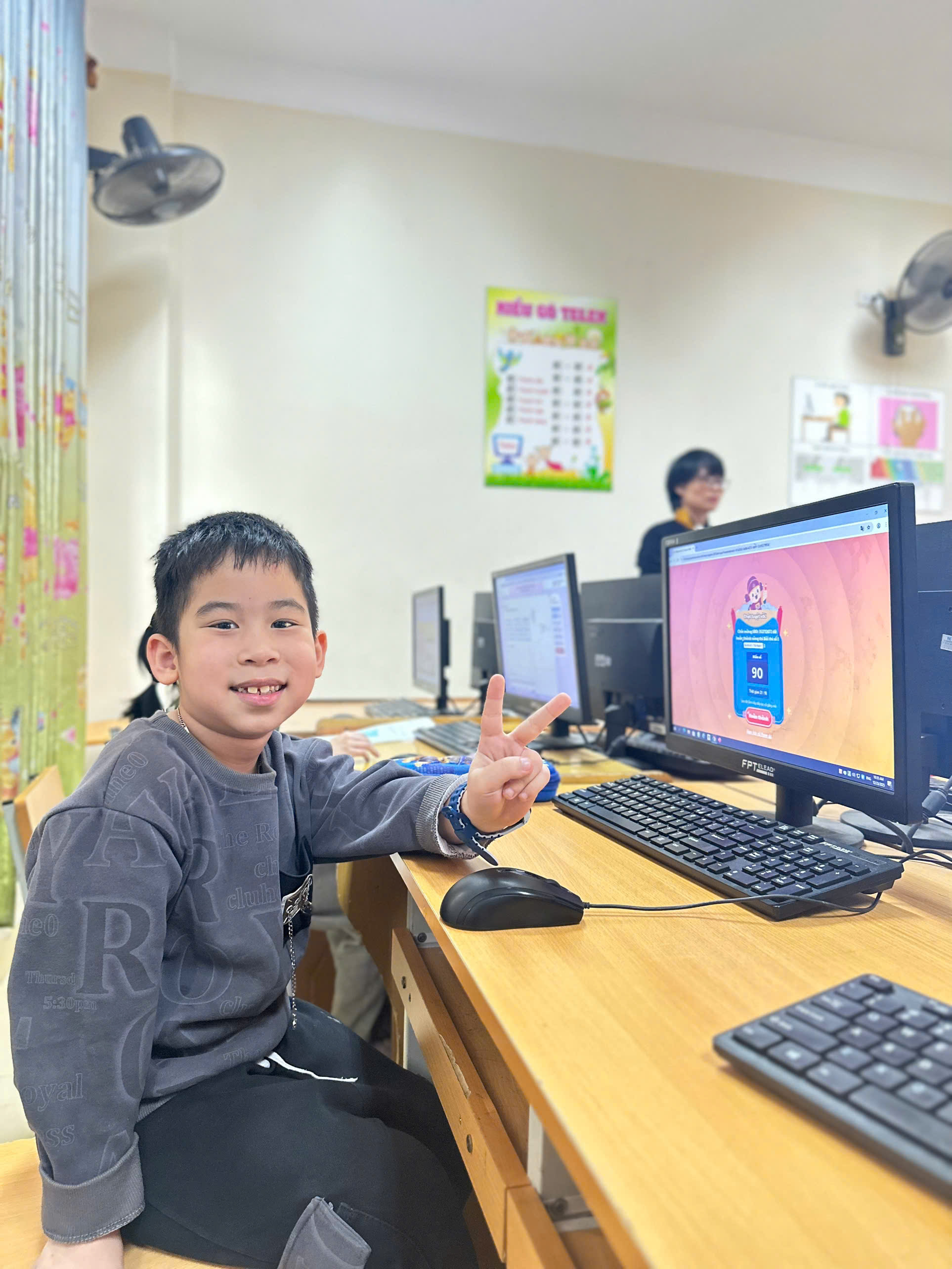 A child sitting at a desk with a computer

AI-generated content may be incorrect.