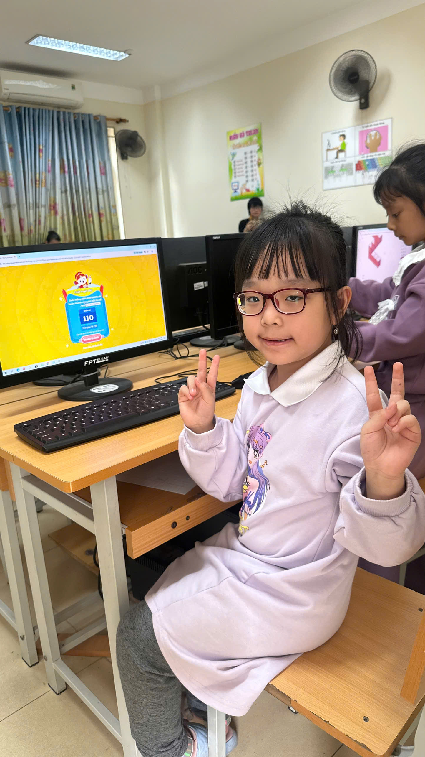 A child sitting in front of a computer

AI-generated content may be incorrect.