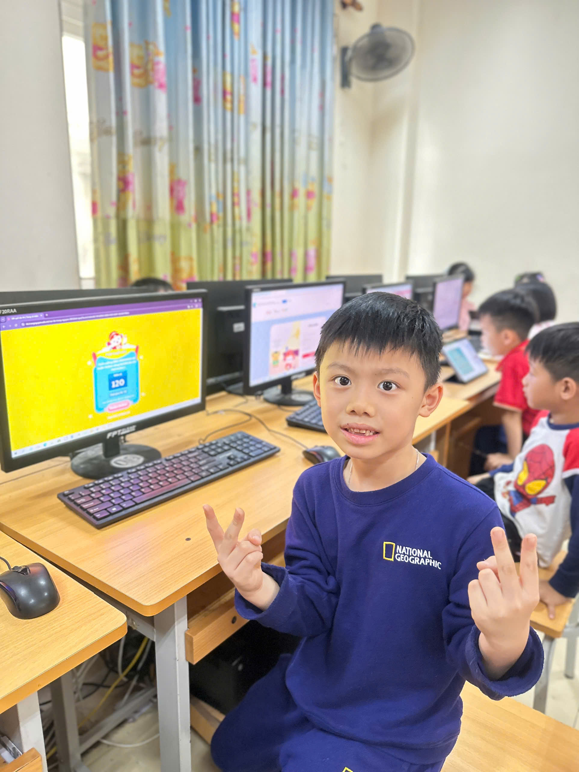 A child sitting at a desk with a computer

AI-generated content may be incorrect.