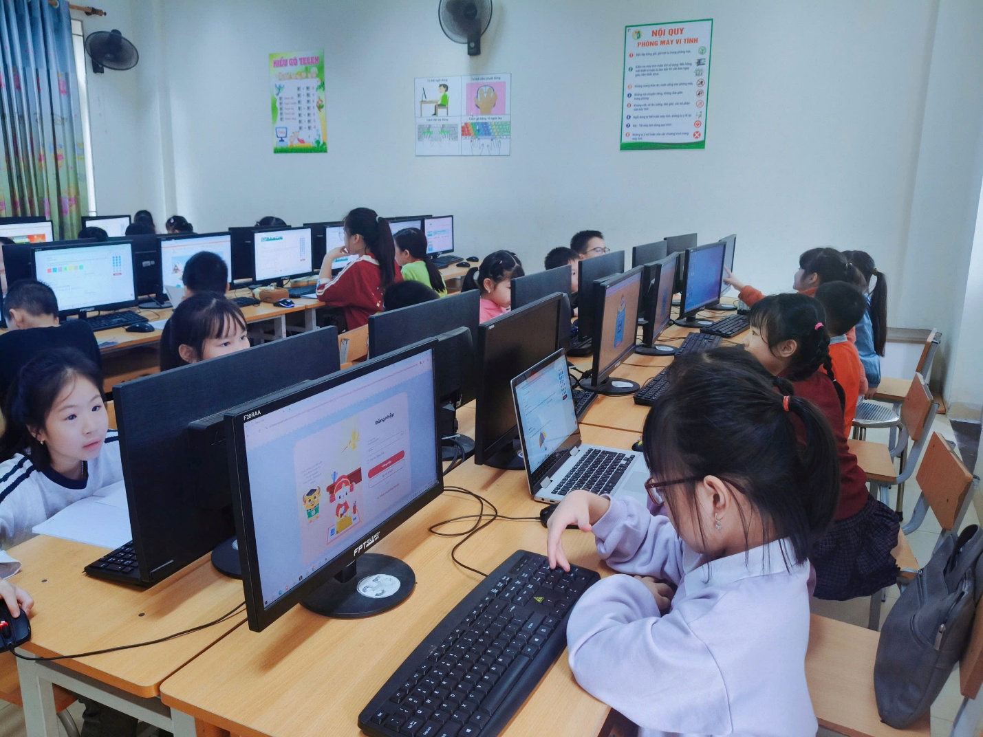 A group of children in a classroom using computers

AI-generated content may be incorrect.