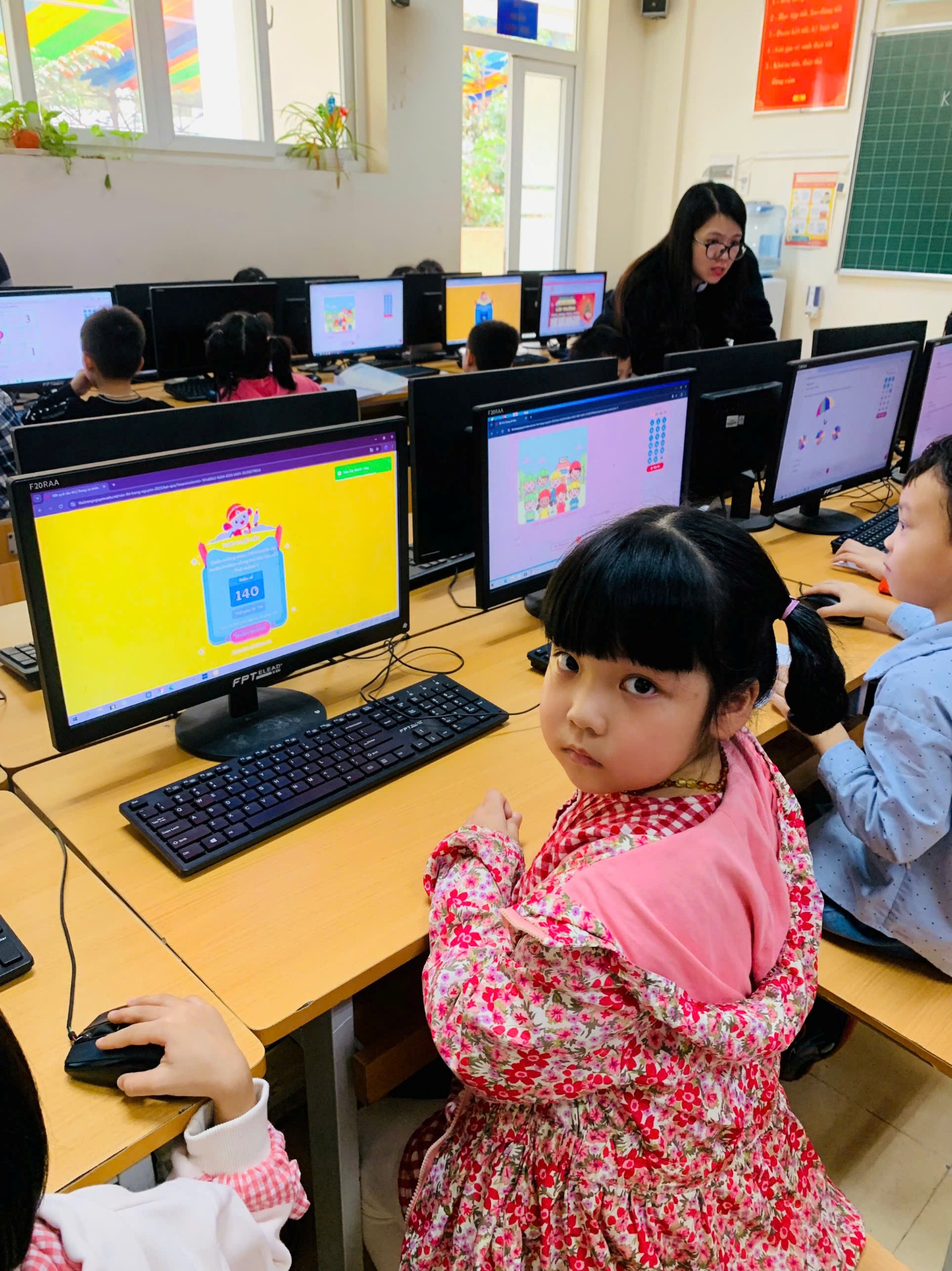 A group of children in a classroom with computers

AI-generated content may be incorrect.