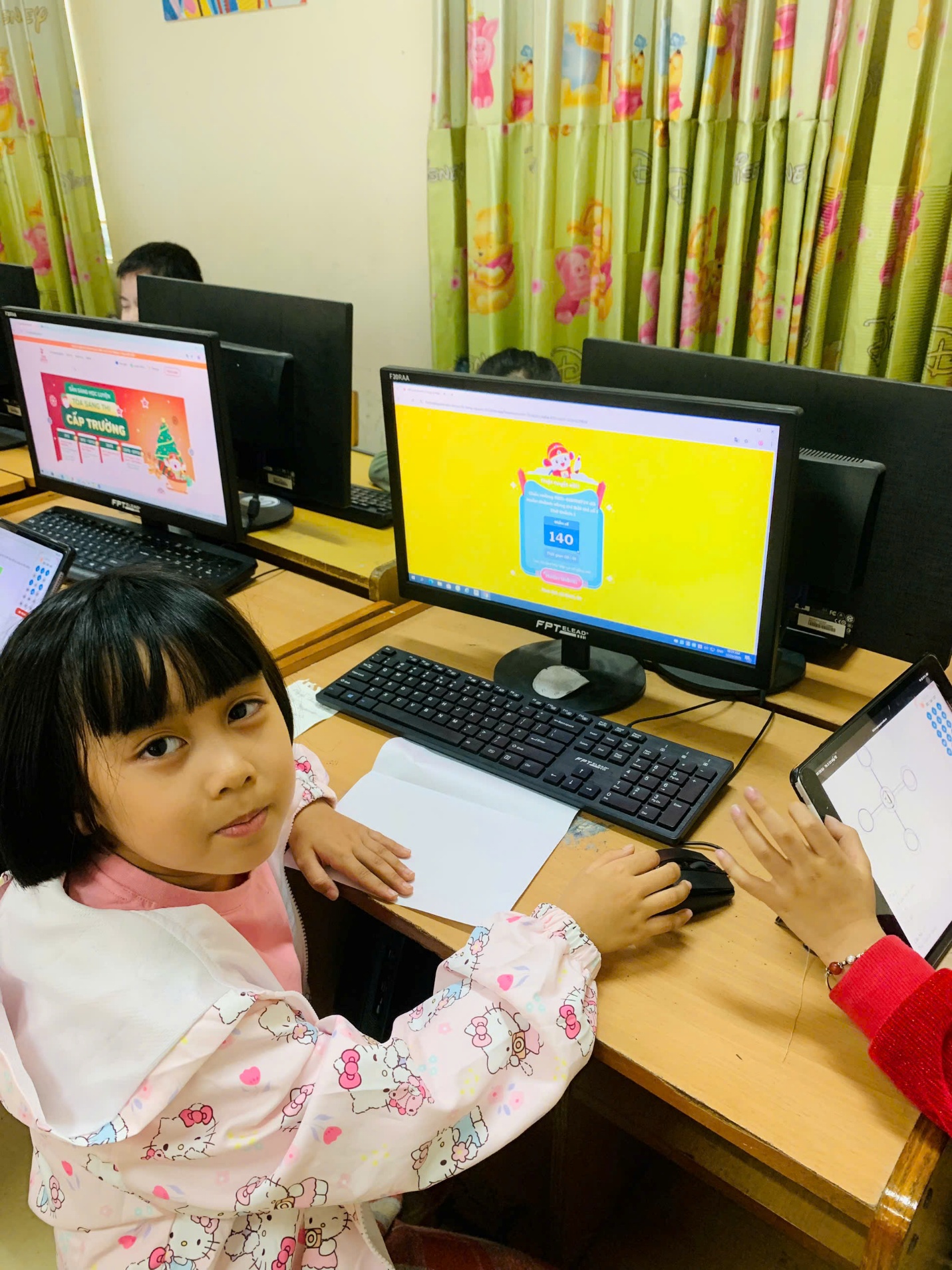 A child sitting at a desk with computers

AI-generated content may be incorrect.