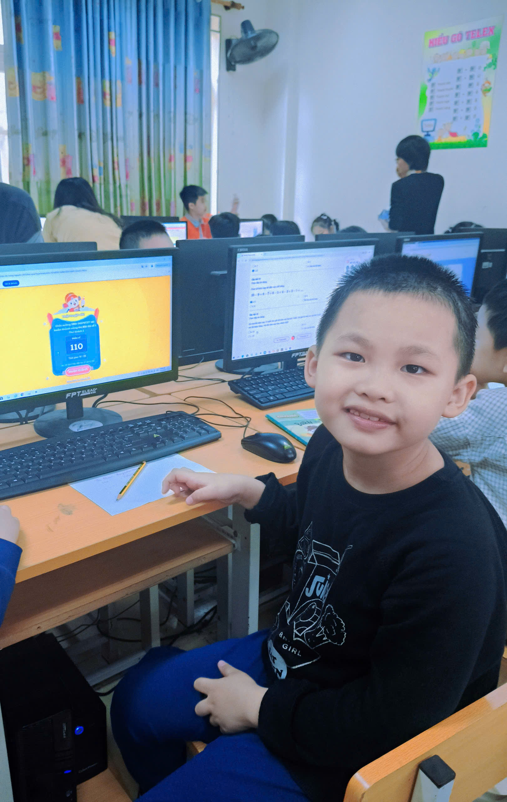 A child sitting at a desk with computers

AI-generated content may be incorrect.