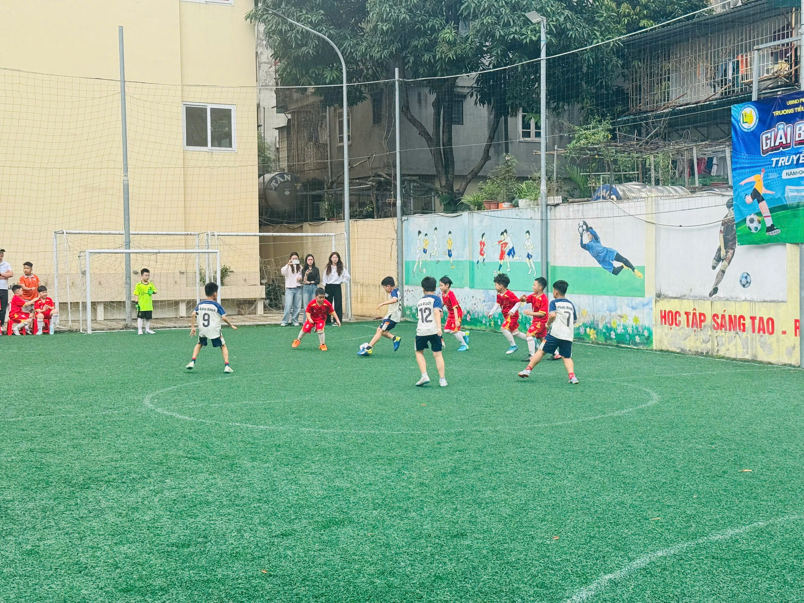 A group of kids playing football
AI-generated content may be incorrect.