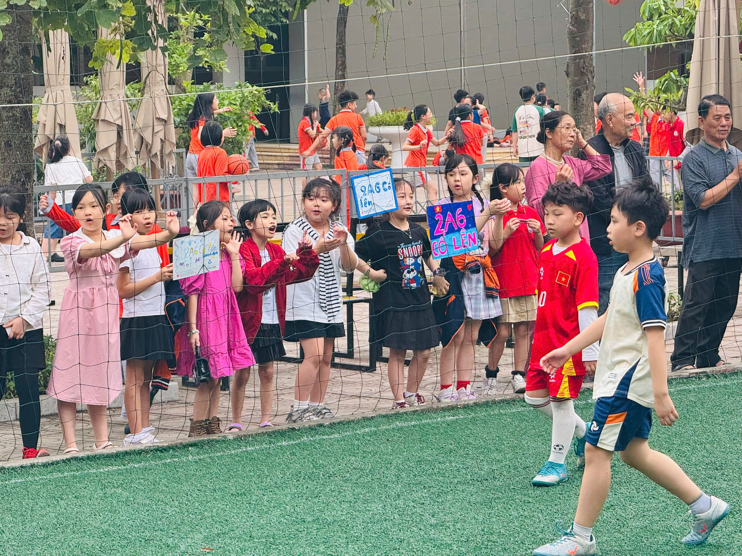 A group of kids playing football
AI-generated content may be incorrect.