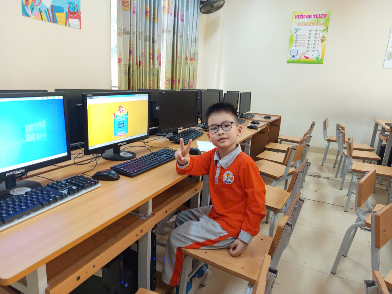 A child sitting at a desk with a computer

AI-generated content may be incorrect.