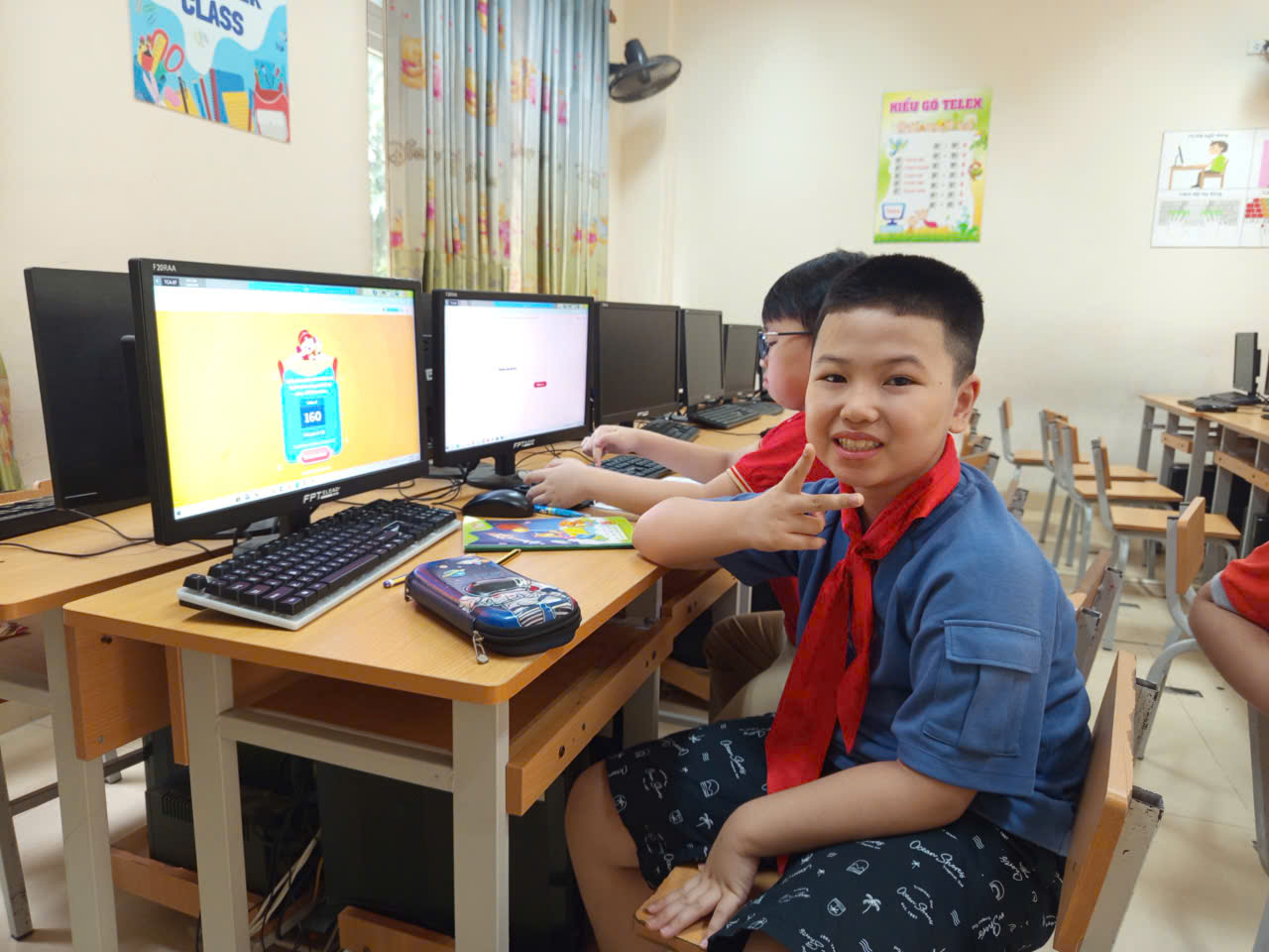 A group of boys sitting at a desk with computers

AI-generated content may be incorrect.