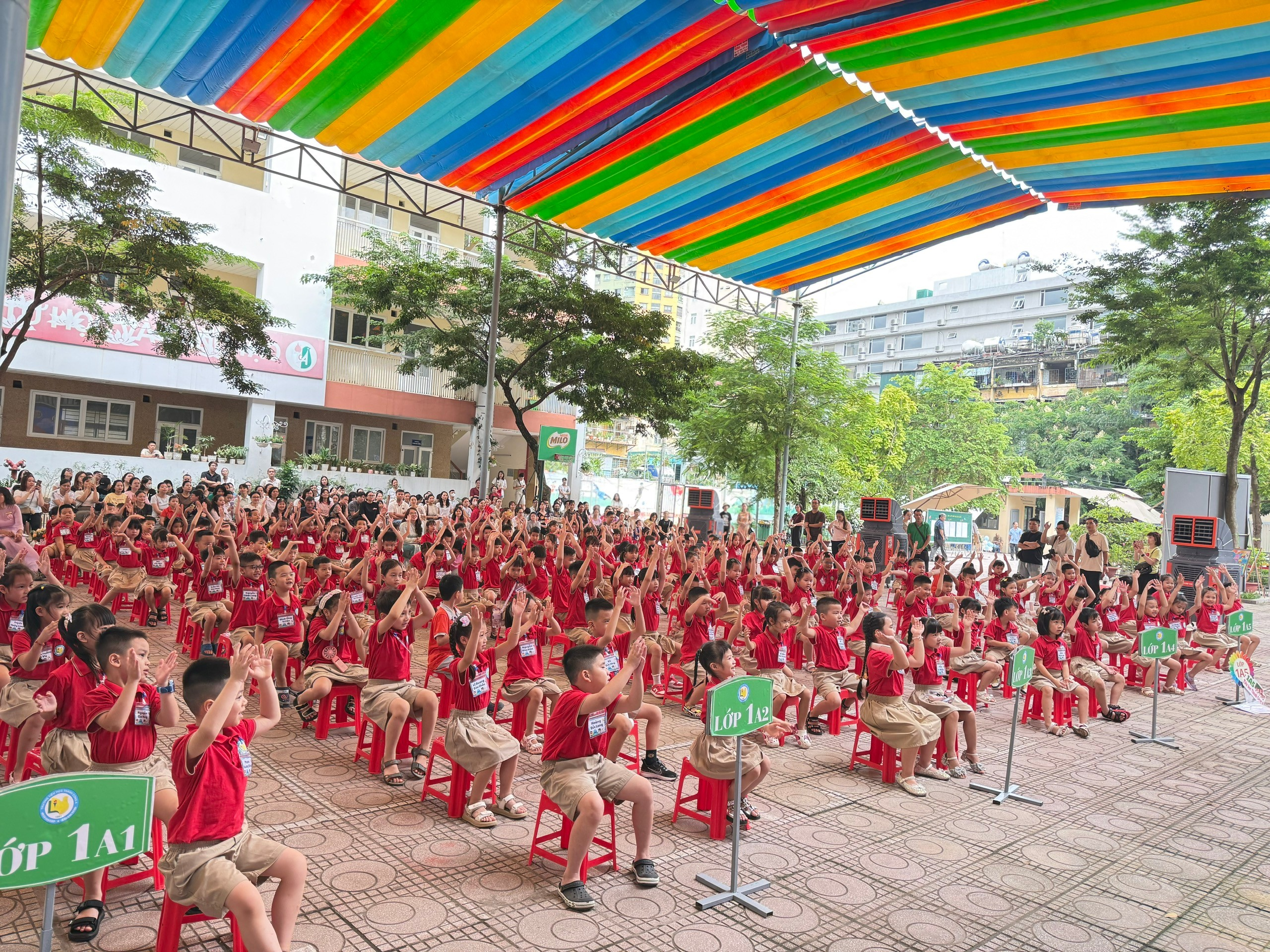 A group of children sitting on chairs
AI-generated content may be incorrect.