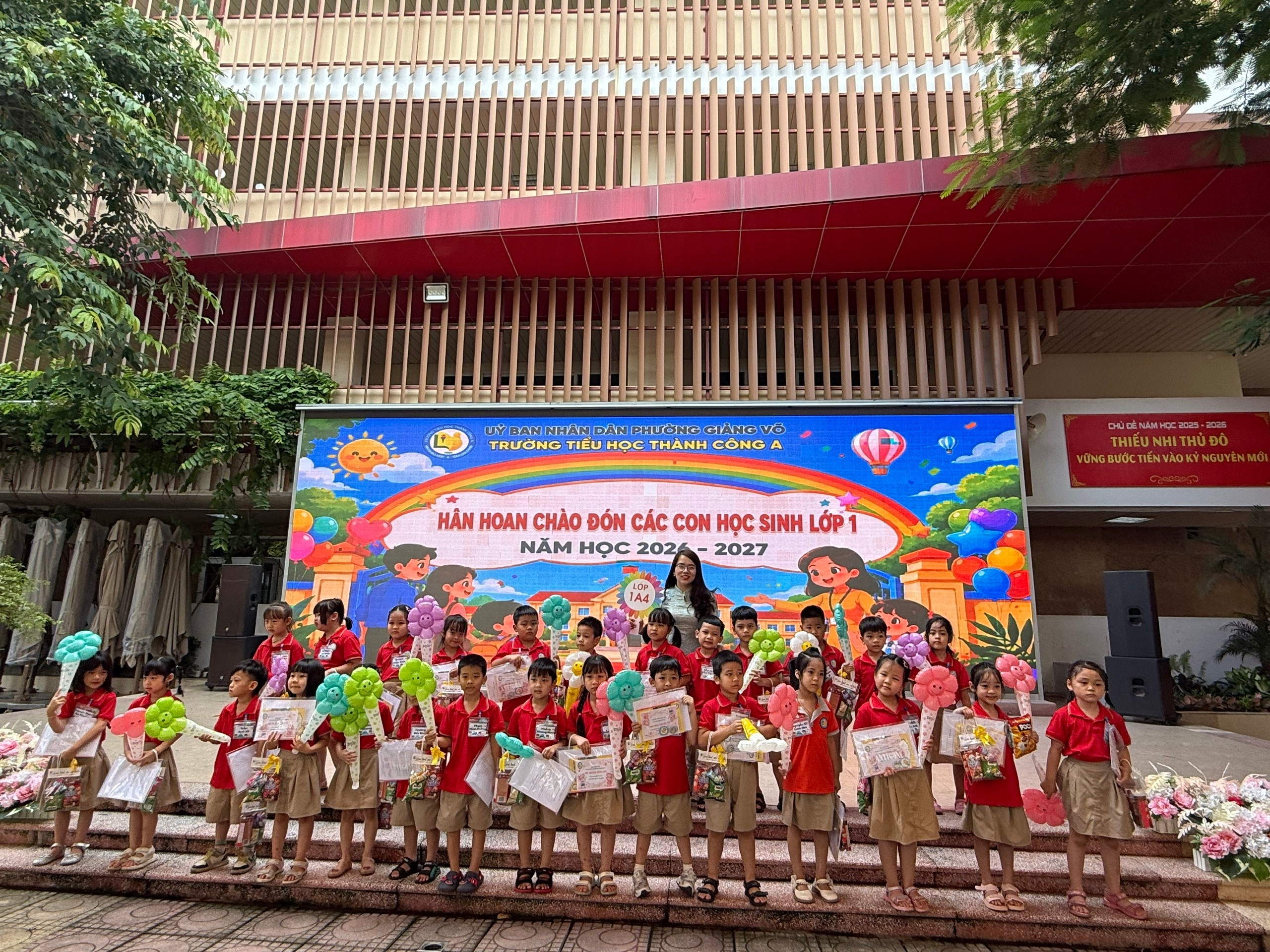 A group of children holding balloons and a sign
AI-generated content may be incorrect.